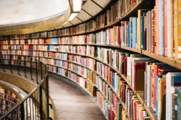 long curved bookshelf in a library